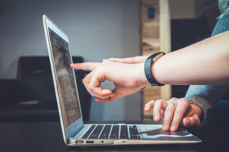 Hands on a laptop keyboard
