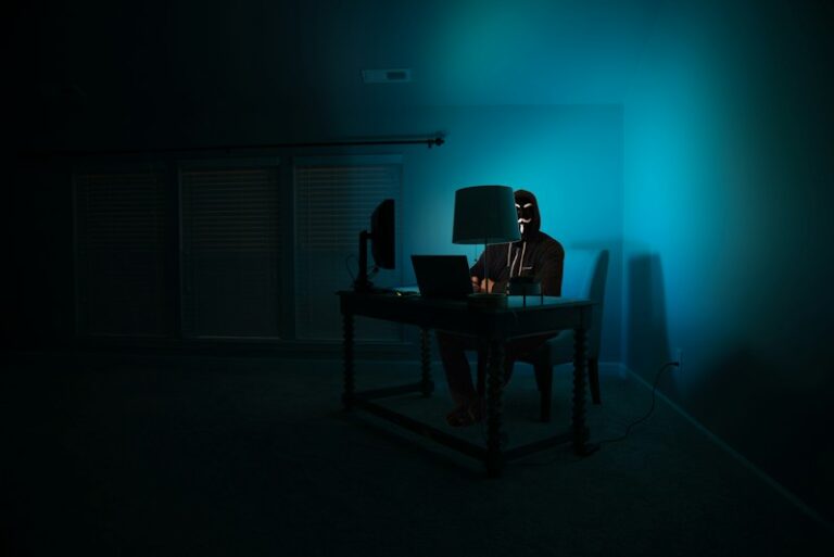 Analyst at a workstation in a dark room