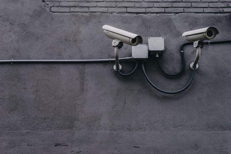 Security camera on a concrete wall